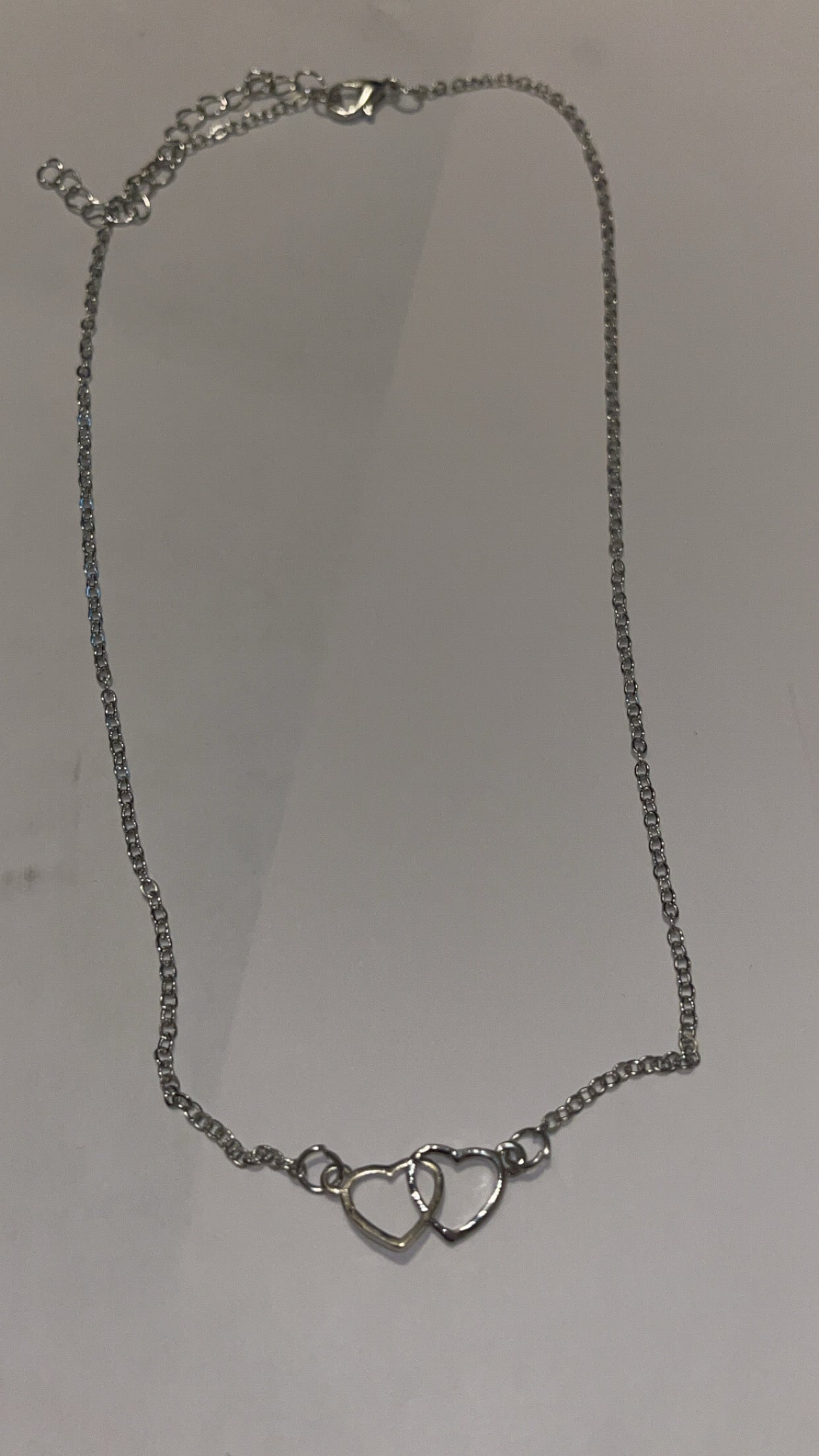 Silver necklace: 2 open hearts