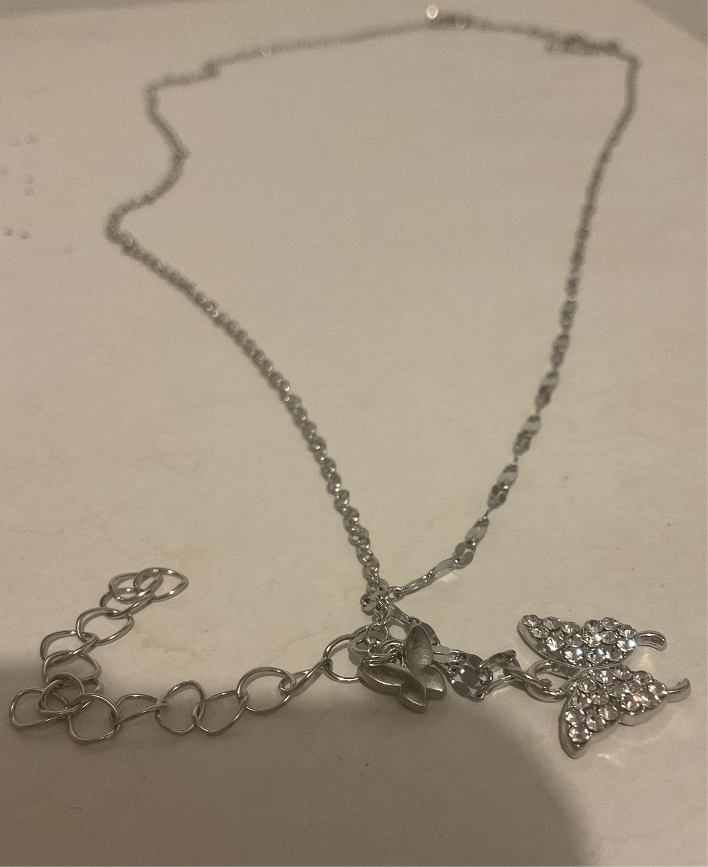 Silver necklace: 1 medium size butterfly with one small butterfly